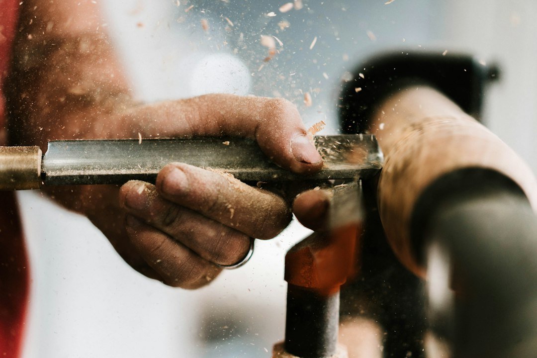 person-holding-silver-and-orange-pipe-1szszjtcubi